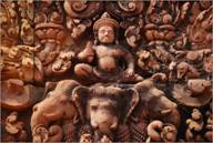 Martin Robinson - Carvings of Hindu God Indra riding on Airavata three-headed elephant at Banteay Srei temple.